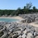 A beach lined with lounge chairs and umbrellas at Blue Lagoon Island